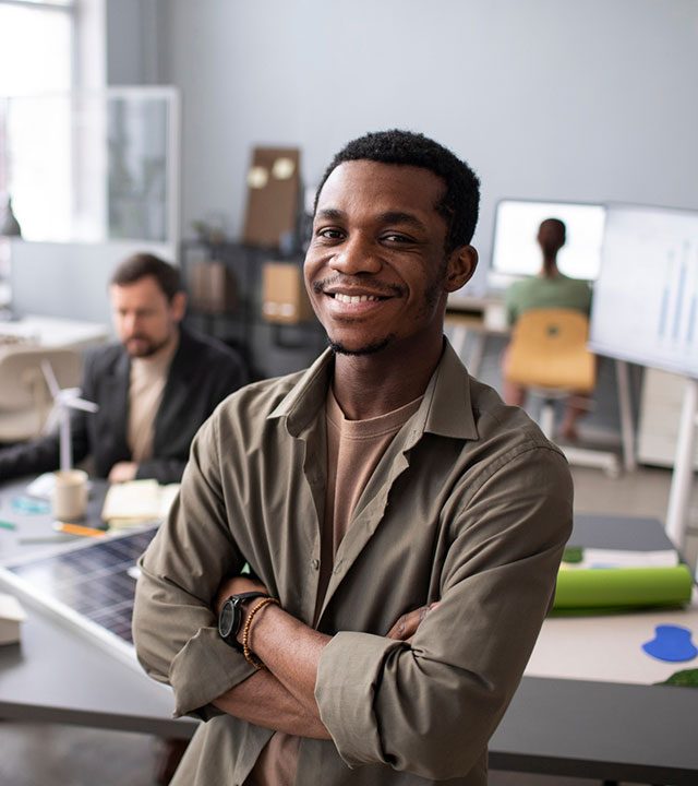black-businessman-in-office-smiling Black man smiling in office, happy about NET 30 Business Accounts